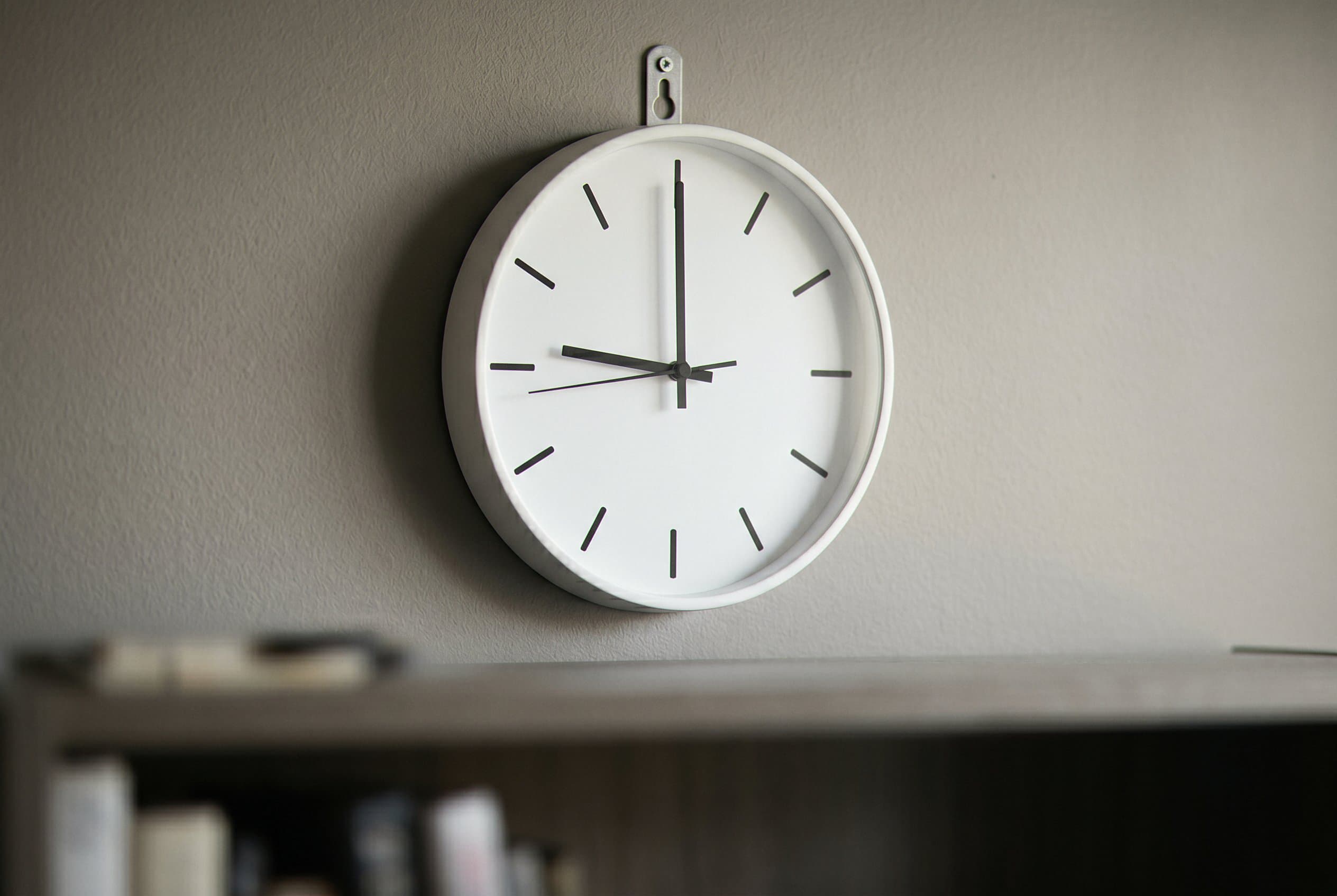 Office wall clock showing passage time