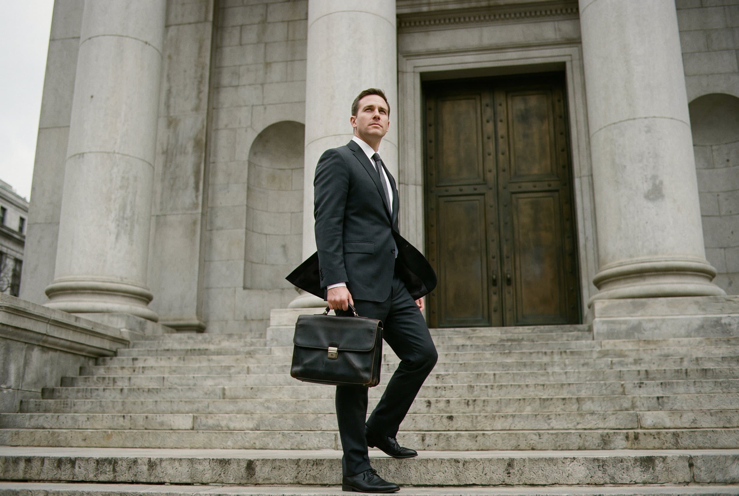 Attorney on courthouse steps with client